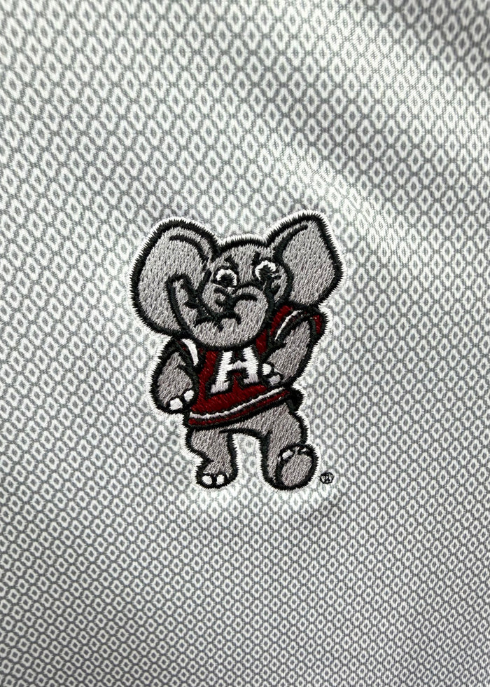 Close-up of a gray embroidered elephant mascot patch with a red and white 'A' jersey, placed on a textured gray fabric background.