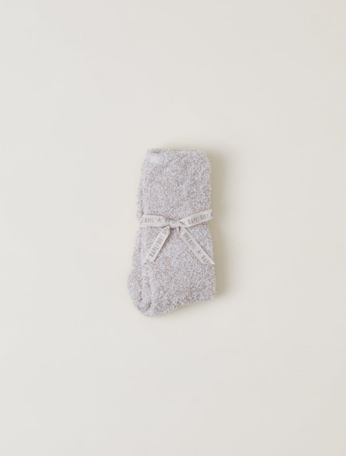 Gray textured socks with a white bow on a light beige background