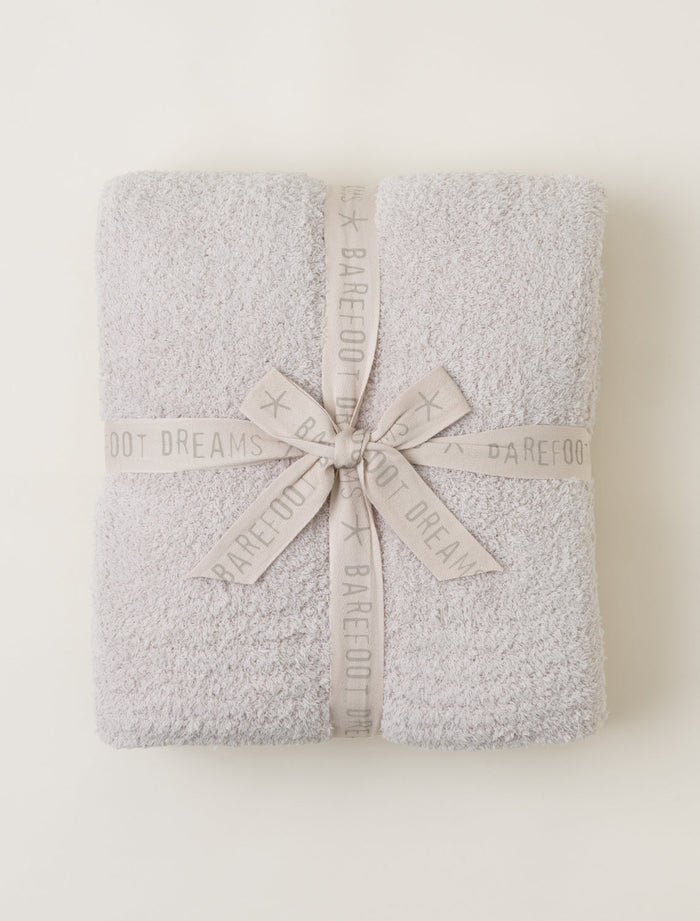 Gray textured blanket with a ribbon on a white background