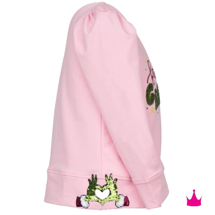 A pink hooded sweatshirt shown from the side, featuring green sequined hands holding a white heart on the cuff and a matching green sequined graphic on the upper sleeve.