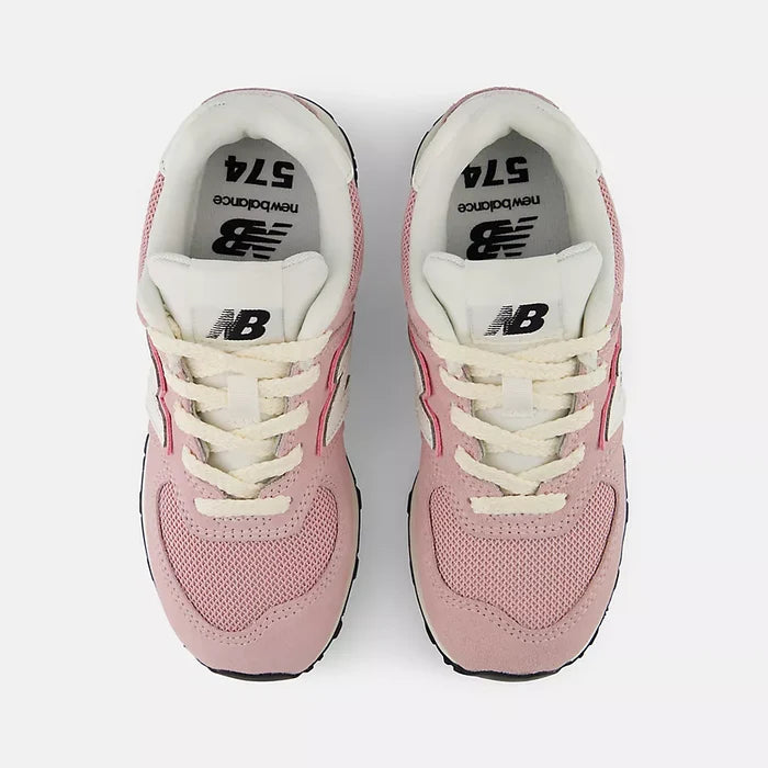 A pair of New Balance 574 sneakers in pink and white, viewed from a top-down angle on a light gray background.