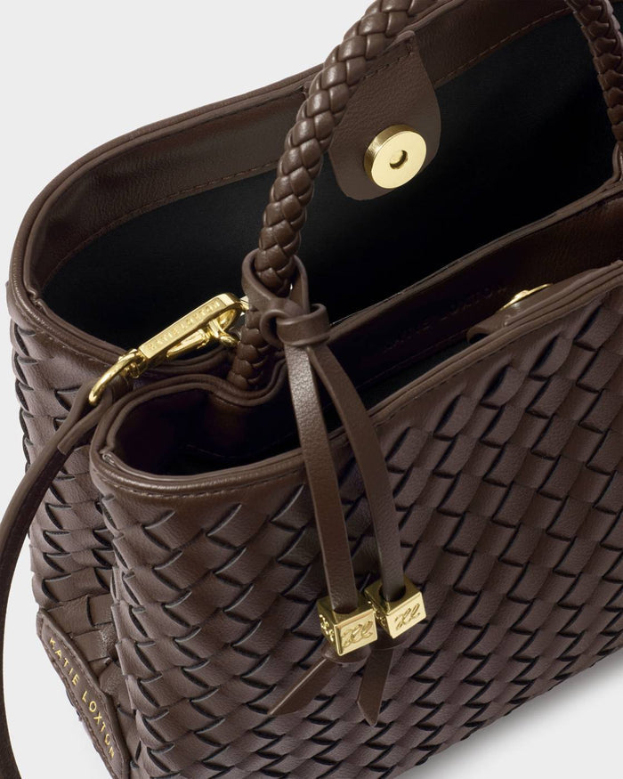 Brown woven handbag with gold accents on a light gray background