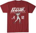 A red short-sleeve graphic t-shirt featuring an illustration of football player Keelon Russell in a white Alabama jersey with the number 12, alongside the text 'KEELON RUSSELL' and the Alabama 'A' logo.