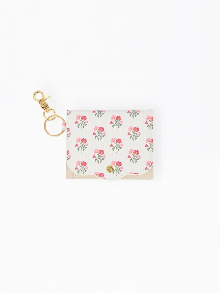 A small white card holder or wallet with a pink and green floral print, featuring a gold-tone metal clasp and key ring, shown on a plain white background.