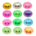Colorful round toys with smiling faces on a white background