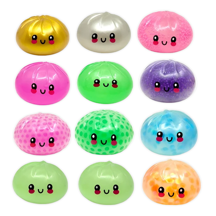 Colorful round toys with smiling faces on a white background
