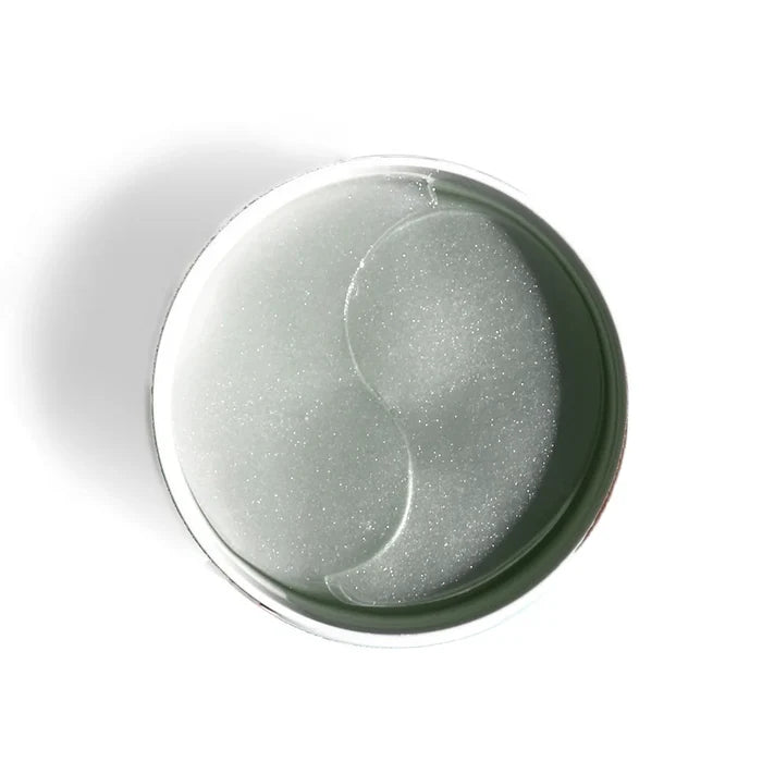 Two eye patches in a round container on a white background