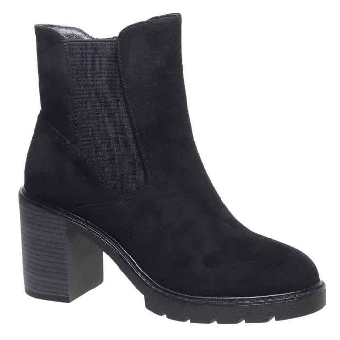 A black suede ankle boot with a chunky block heel and a wide, treaded sole, shown from a side profile on a white background.