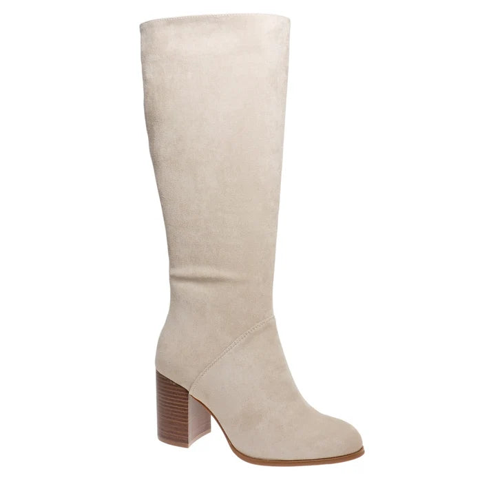 A single knee-high boot in light beige suede with a brown block heel, shown from a side profile on a white background.