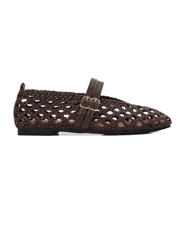 A single brown slip-on woven flat, shown in a side profile against a white background.