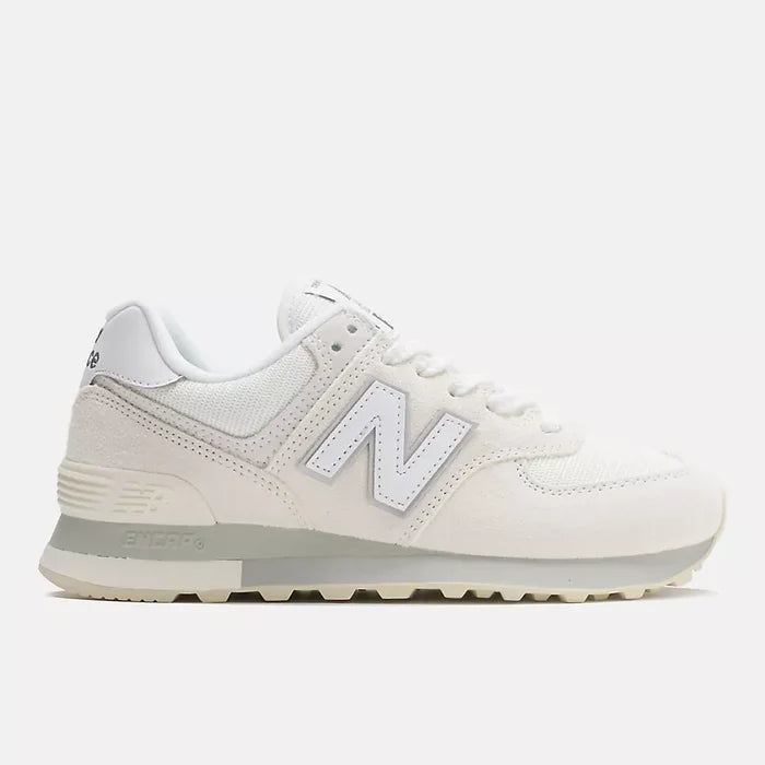 A classic New Balance sneaker in off-white and light gray, featuring the signature 'N' logo on the side, set against a solid light gray background.
